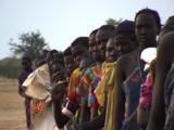People Stand In Line Waiting For Food Aid. Sudan
